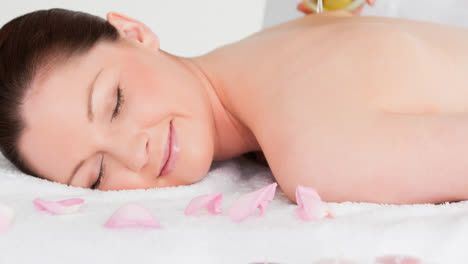 smiling caucasian woman having relaxing treatment