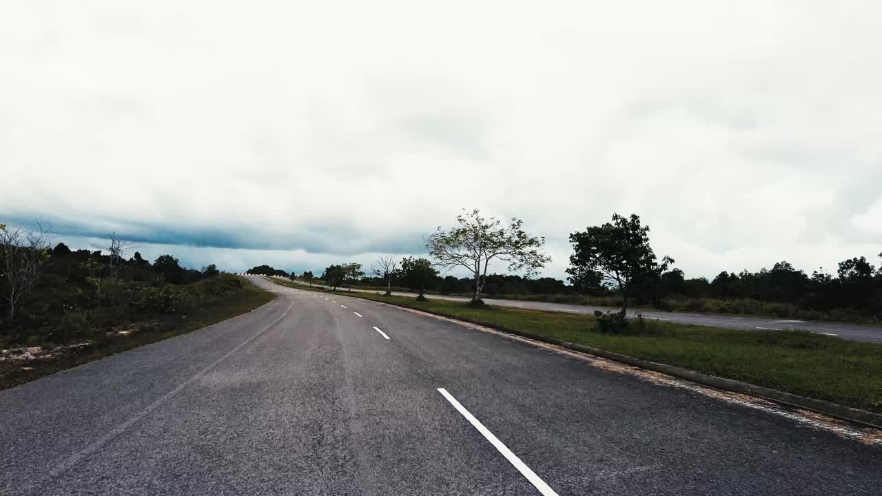 Beautiful View Drive Along Sempadi Lundu Coastal Road with Green Forest and Mountain,Sarawak,Borneo.