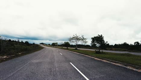 beautiful view drive along sempadi lundu coastal road with green forest and mountain,sarawak,borneo.