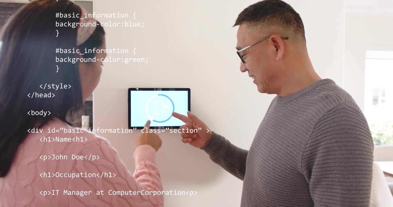 Father pointing at spinner and daughter tapping panel and scrolling clear overlay for tech setup