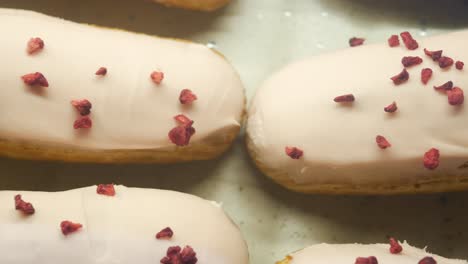 pink eclairs with dried raspberries