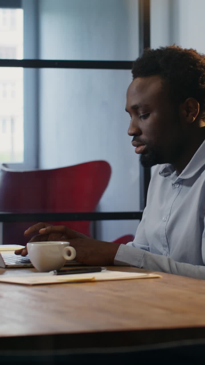 Man Working on Laptop in Office