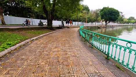 scenic pathway beside west lake in hanoi, vietnam