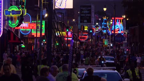 night scene on beale street memphis tennessee entertainment district with neon signs bars nightclubs and crowds