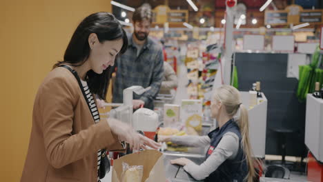 customer checking out at grocery store