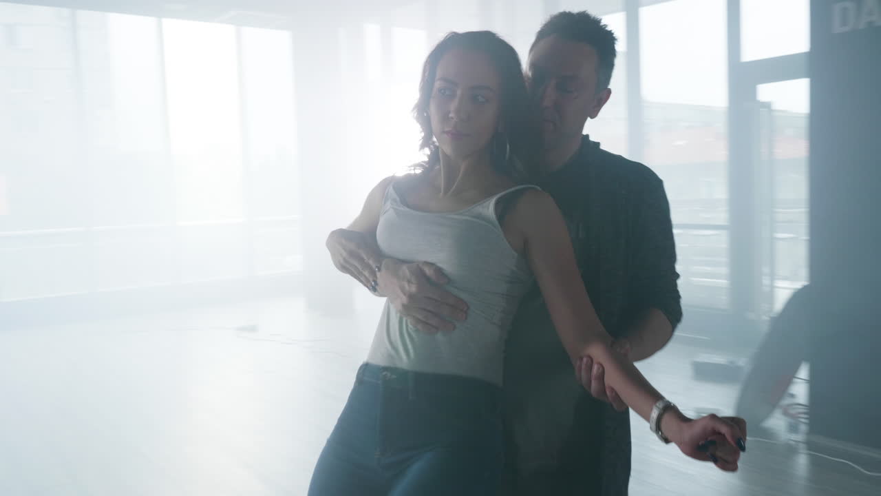 Couple Dancing Salsa in Studio