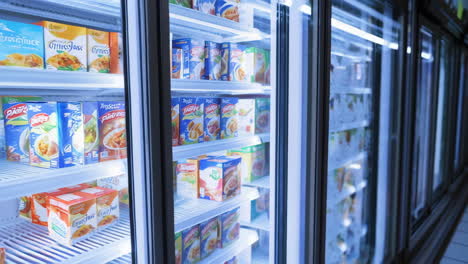 close-up of refrigerated display cases filled with packaged food products in a store
