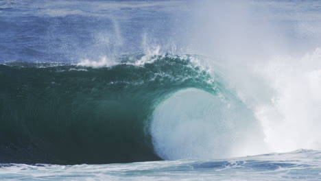 crashing ocean wave with rising mist and glowing texture, shot in slow motion