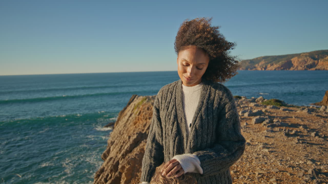 Windy hair model resting ocean shore closeup. Loving couple at sea cliff date