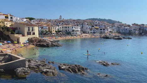 beach in costa brava calella de palafrugell tamariu catalunya spain fishing village mediterranean sea transparent turquoise blue waters paddle surf to the beach