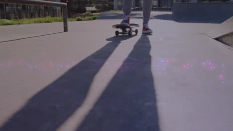 woman balancing on skateboard at skatepark, showing speed gauge and rail graphic for marketing