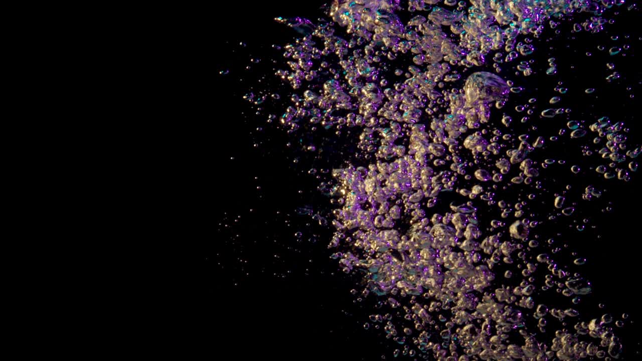 pink bubbles in dark water