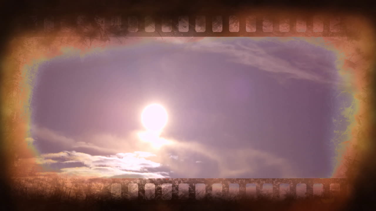 Sun shining over clouds with film strip animation border, creating cinematic effect
