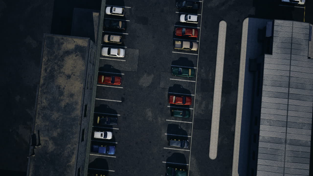 Cars parked in a lot next to a building on a sunny day