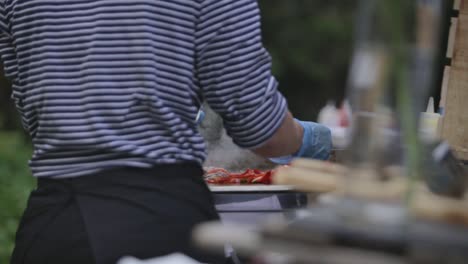 Crop-man-grilling-vegetables-outside