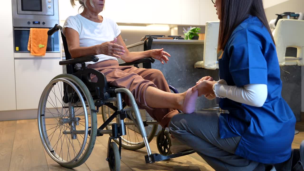 Physical Therapist Assisting Patient in Wheelchair