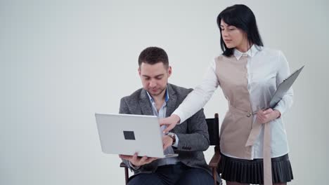 Couple browsing on laptop. Portrait of business couple looking at laptop computer
