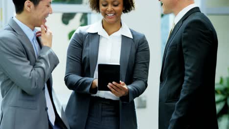 multi ethnic male female team meeting wireless tablet