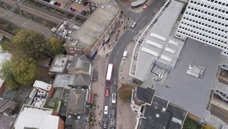 orbital aerial shot circling the broadway thoroughfare and surrounding urban infrastructure near ealing broadway station, london, uk, october 2024