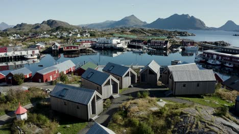 aerial drone shot of remote fishing town in the arctic circle with modern buildings