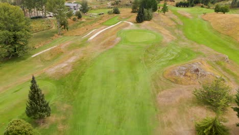 flying over golf course in new zealand - aerial