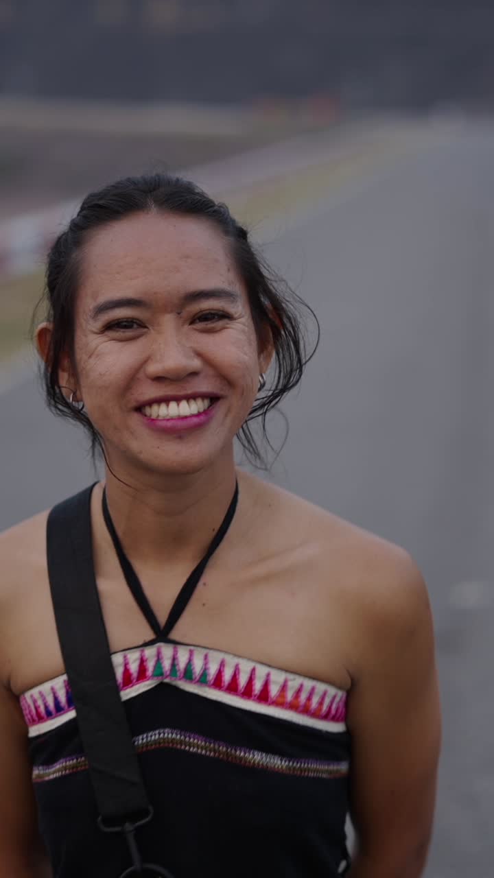 Smiling woman on a road
