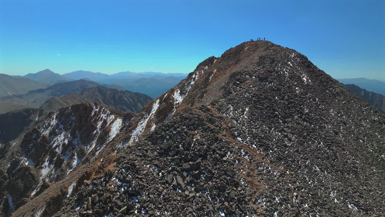 Huron Peak Collegiate Peaks summit 14er hike climb summer fall autumn Rocky Mountains Colorado drone aerial Three Apostles Ice Mountain La Plata Buena Vista sunny blue sky snow circle right motion