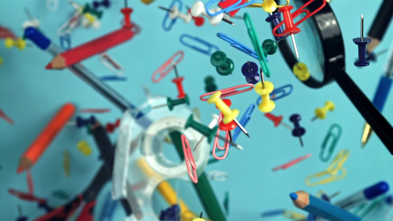 Colorful Office and School Supplies Falling in Slow Motion