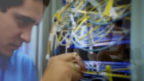 technician working with cables over person using virtual reality headset