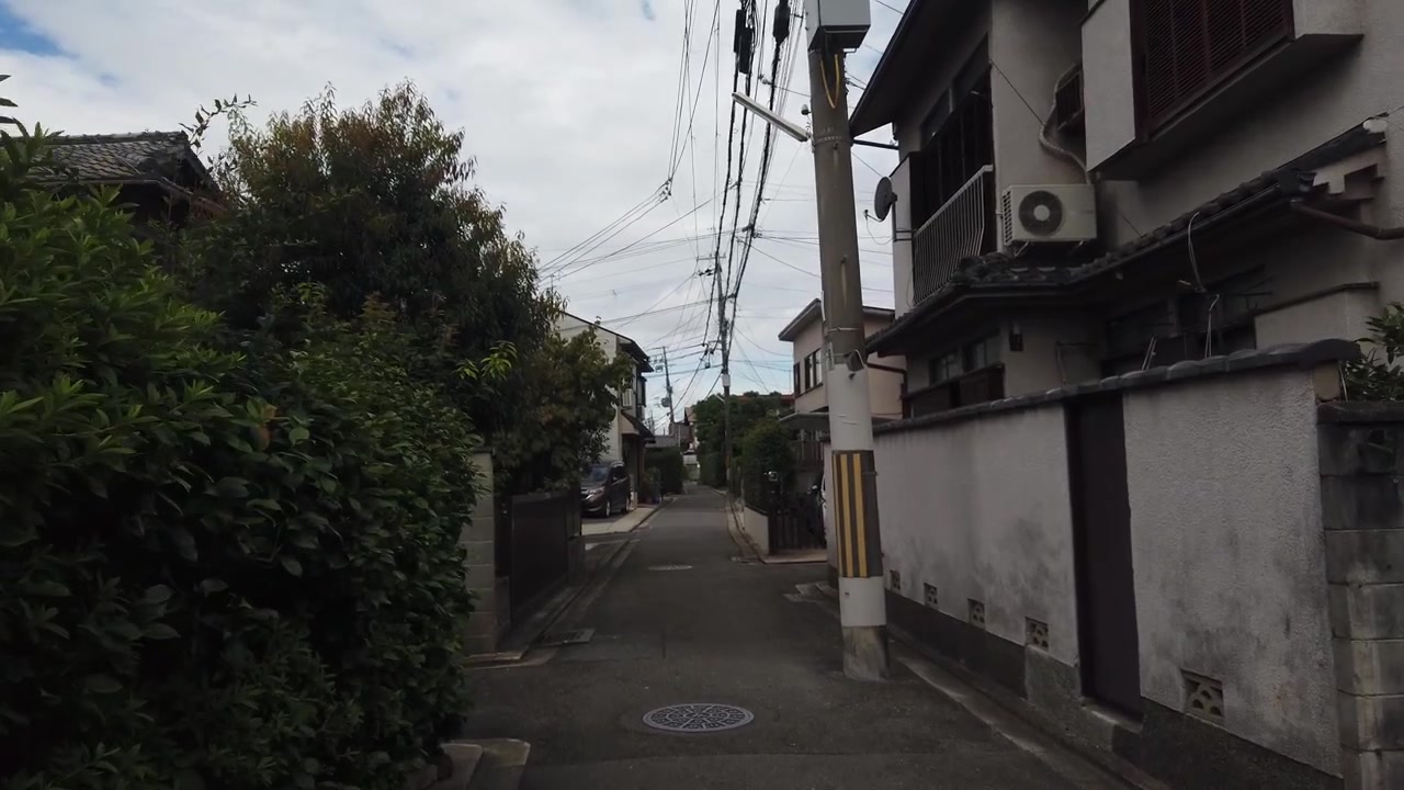 Walking POV Through Quiet Residential Streets of Kyoto Japan with Traditional Homes and Greenery