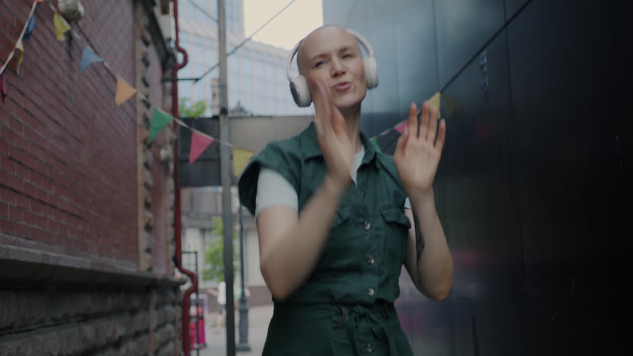 Woman Dancing in an Alleyway with Headphones