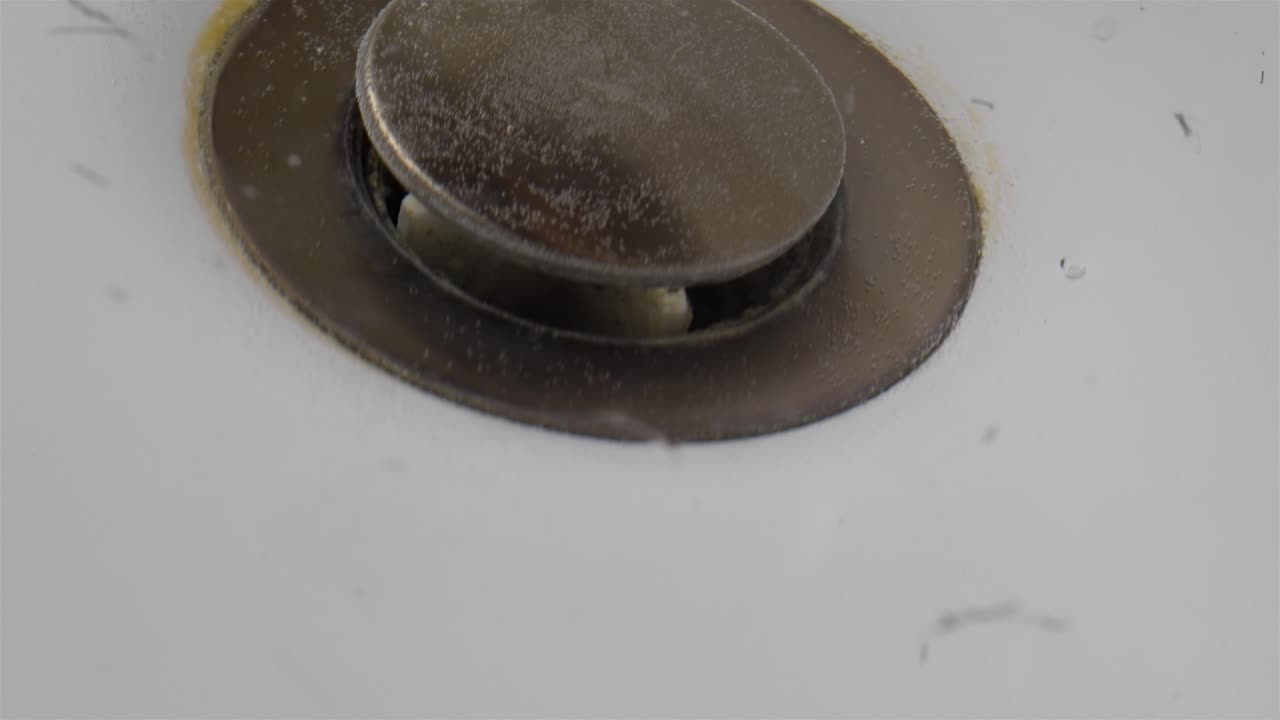 After Shaving Mess: Hairs Around Sink Drain Plug