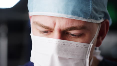 Surgeon-looking-down,-close-up