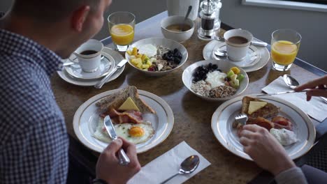 slowmo - a couple having healthy breakfast at a luxury boutique hotel