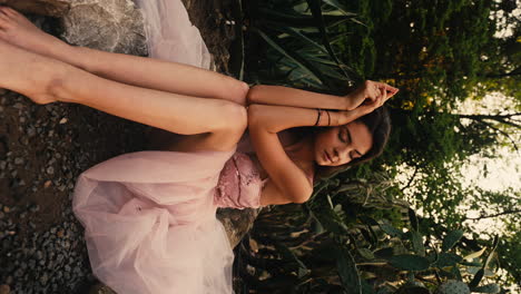 bridesmaid siting in cactus garden, waiting, wearing pink dress, sunset, golden hour, cinematic close up cinematic vertical