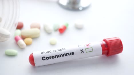 coronavirus blood sample test with medications and stethoscope