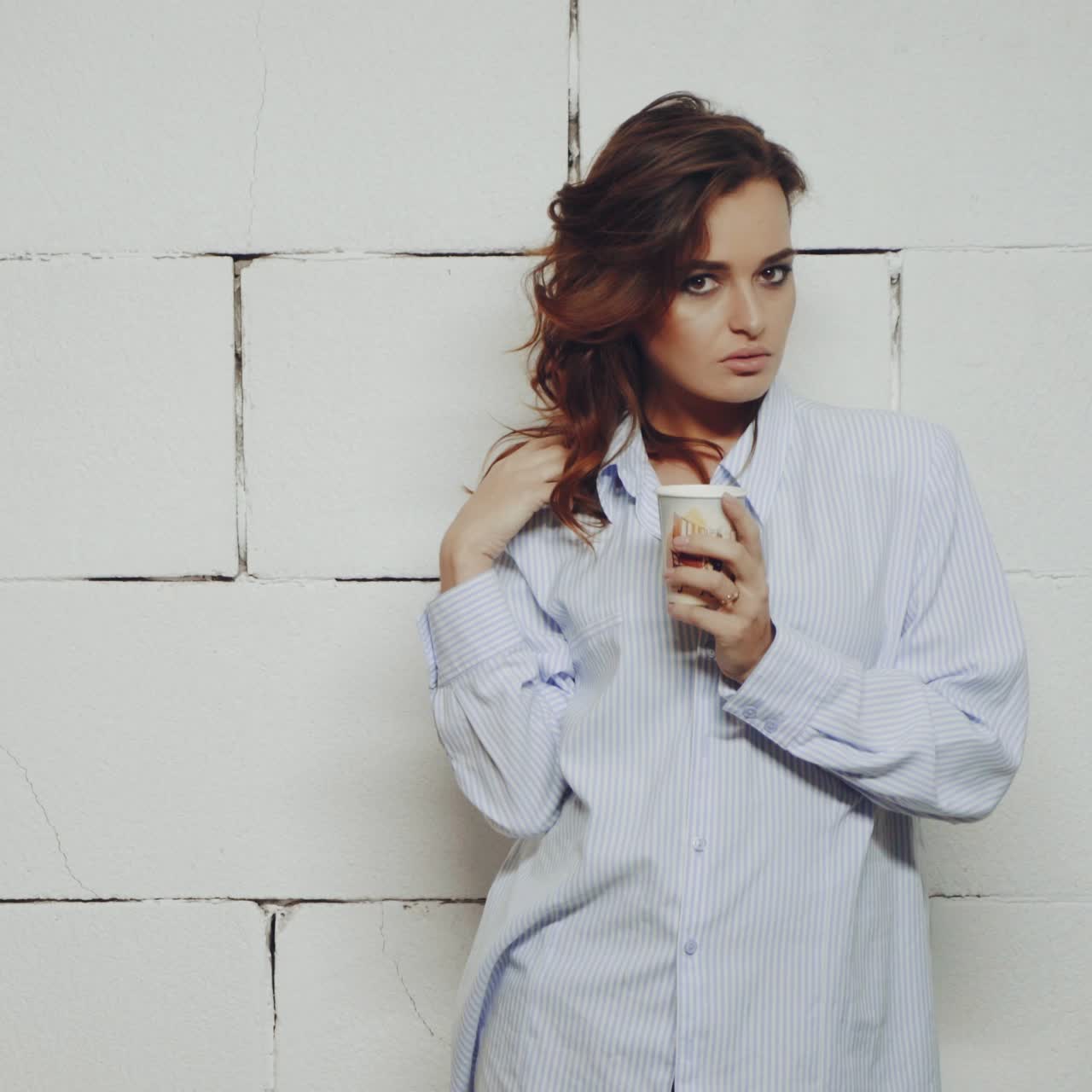 Woman drinking cup of coffee