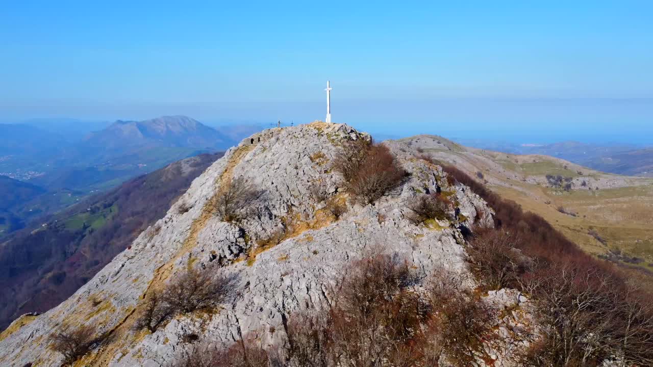 Mountain peak with a cross on top