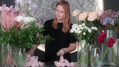 florist arranging beautiful flower bouquets