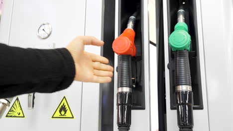 person filling car with gas at a gas station