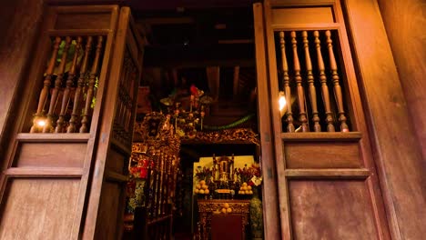 opening doors reveal ornate temple interior