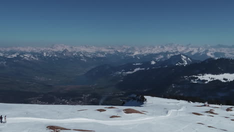 a drone film with a scenic view to the swiss mountains.
some people are hiking to the top.