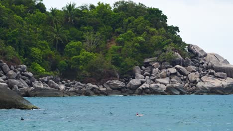 Beautiful-natural-ocean-scenery-with-people-snorkeling