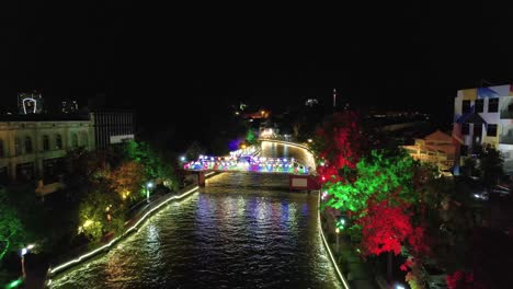 Establishing-drone-shot-of-the-very-bright-and-colourful-Malacca-river-bridge