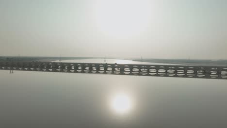 Sunrise-over-Sukkur-Barrage,-Sindh---aerial