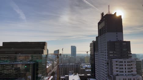 sunrise over warsaw skyline with modern architecture in january