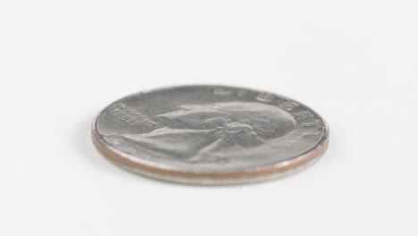 washington quarter laid flat on white table