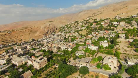 fpv flight over the houses in the town near the desert in lebanon