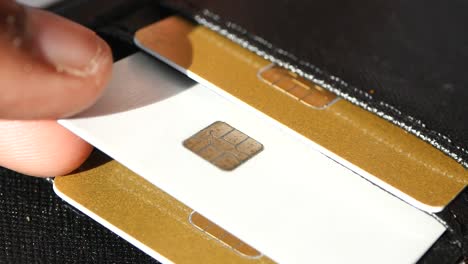 close up of a credit card in a black wallet.