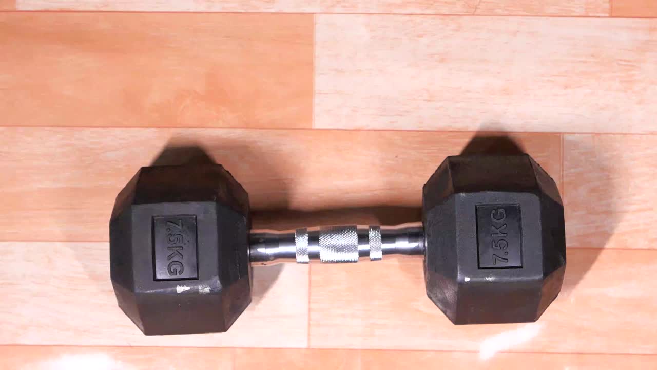 Person holding dumbbells